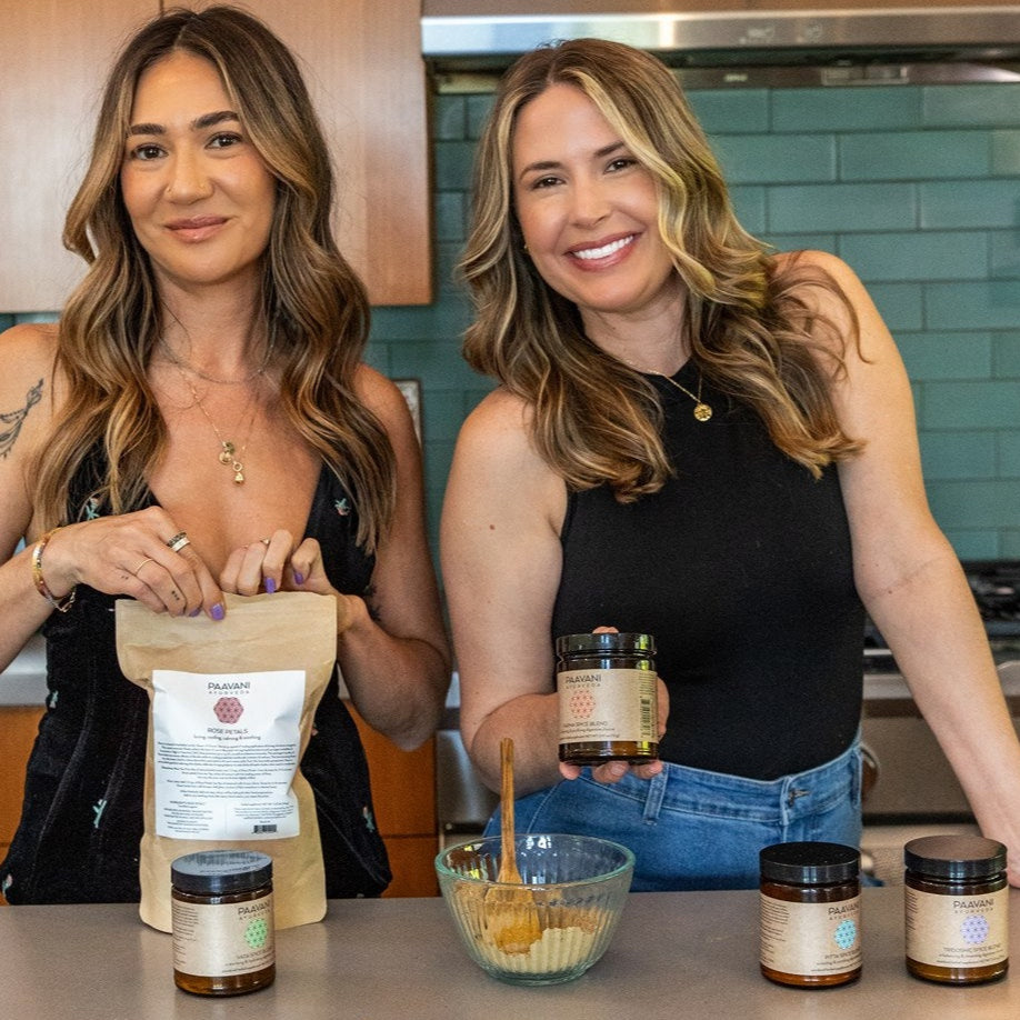 PAAVANI Ayurveda co-founders in a kitchen with PAAVANI Spice Blends and Rose Petals