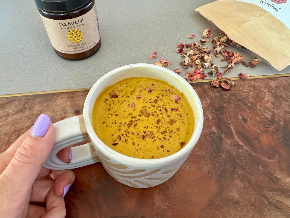 Rose golden milk in a ceramic mug supporting sluggish digestion in February