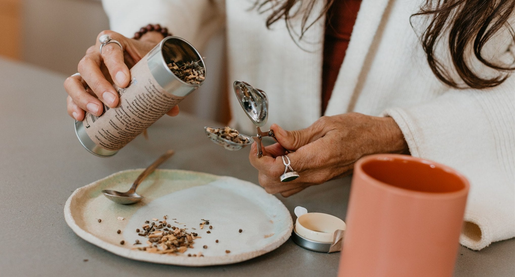 Woman brewing a cup of PAAVANI Ayurveda Woman's Blend Tea