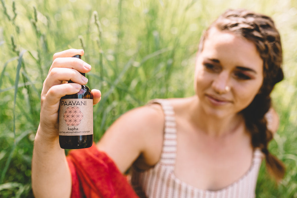 Kapha Woman holding PAAVANI Ayurveda Kapha Spritzer