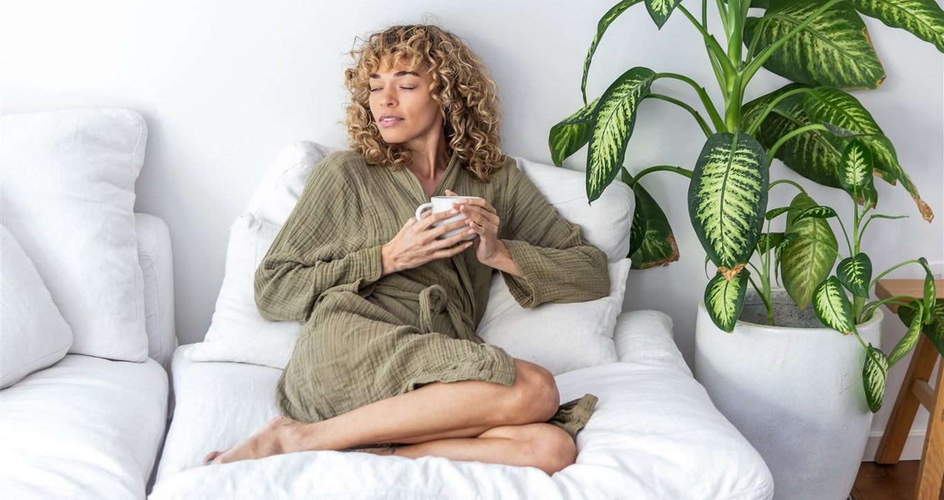 Woman drinking PAAVANI hydrate blend tea to build rasa dhatu & skin health