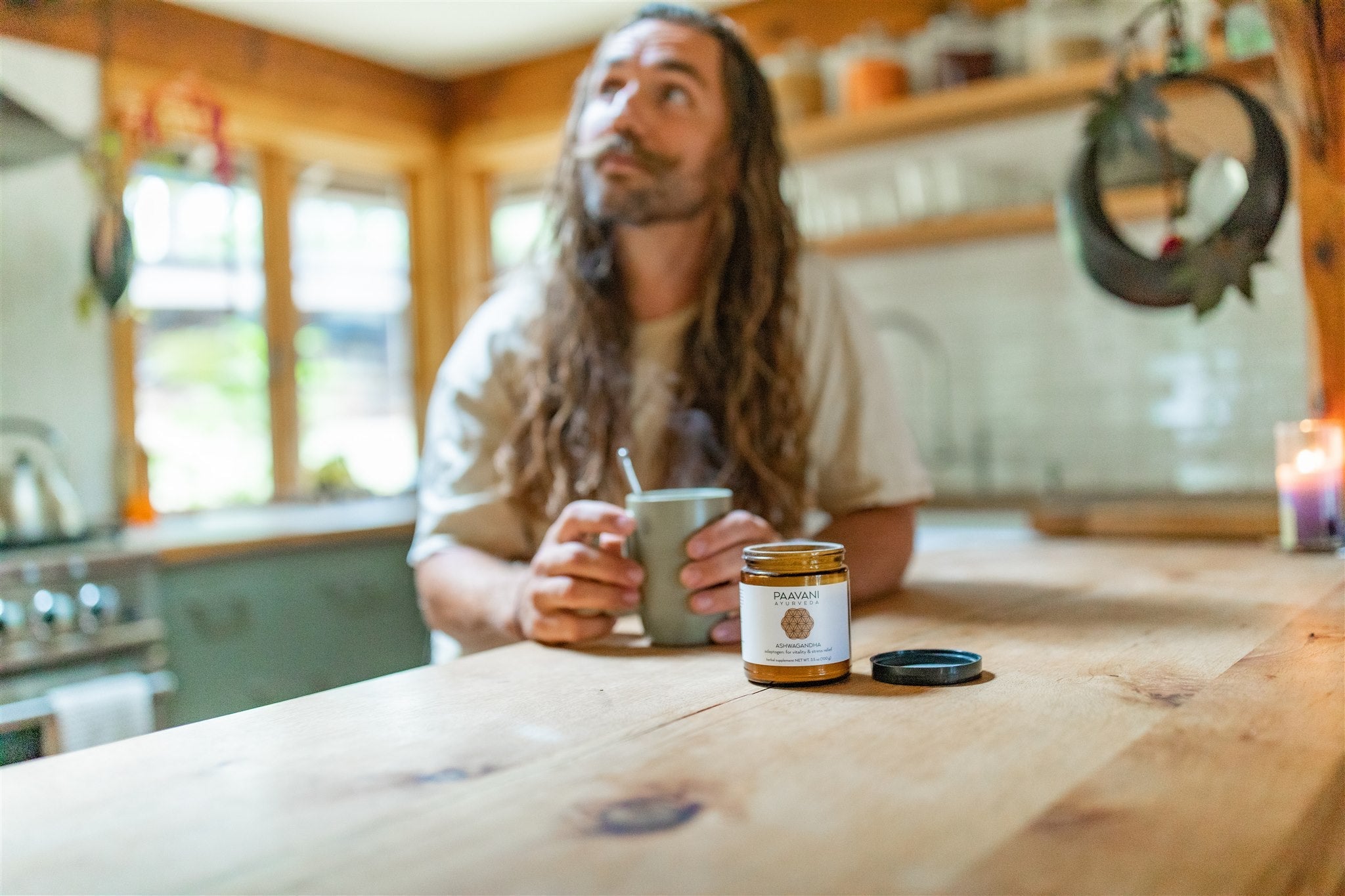 Man drinking PAAVANI Ayurveda Ashwagandha churna