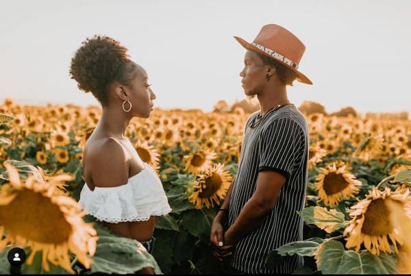 two people in sunflower field