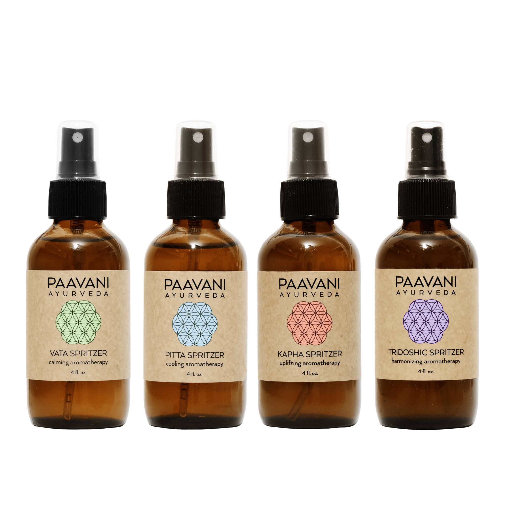 Four bottles of Paavani Ayurveda spritzers on a white background