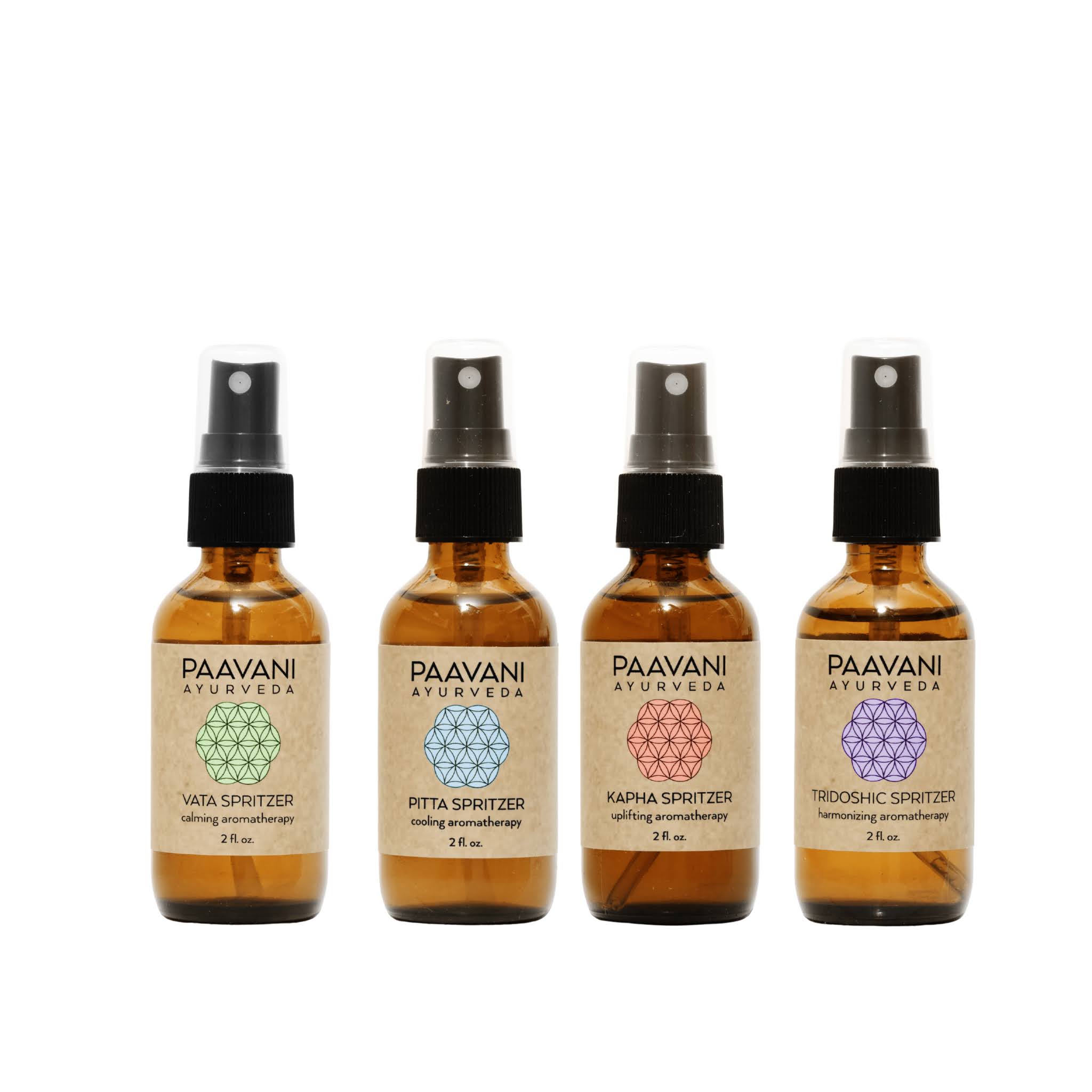 Four aromatherapy spritzers bottles of Paavani Ayurveda spritzers on a white background