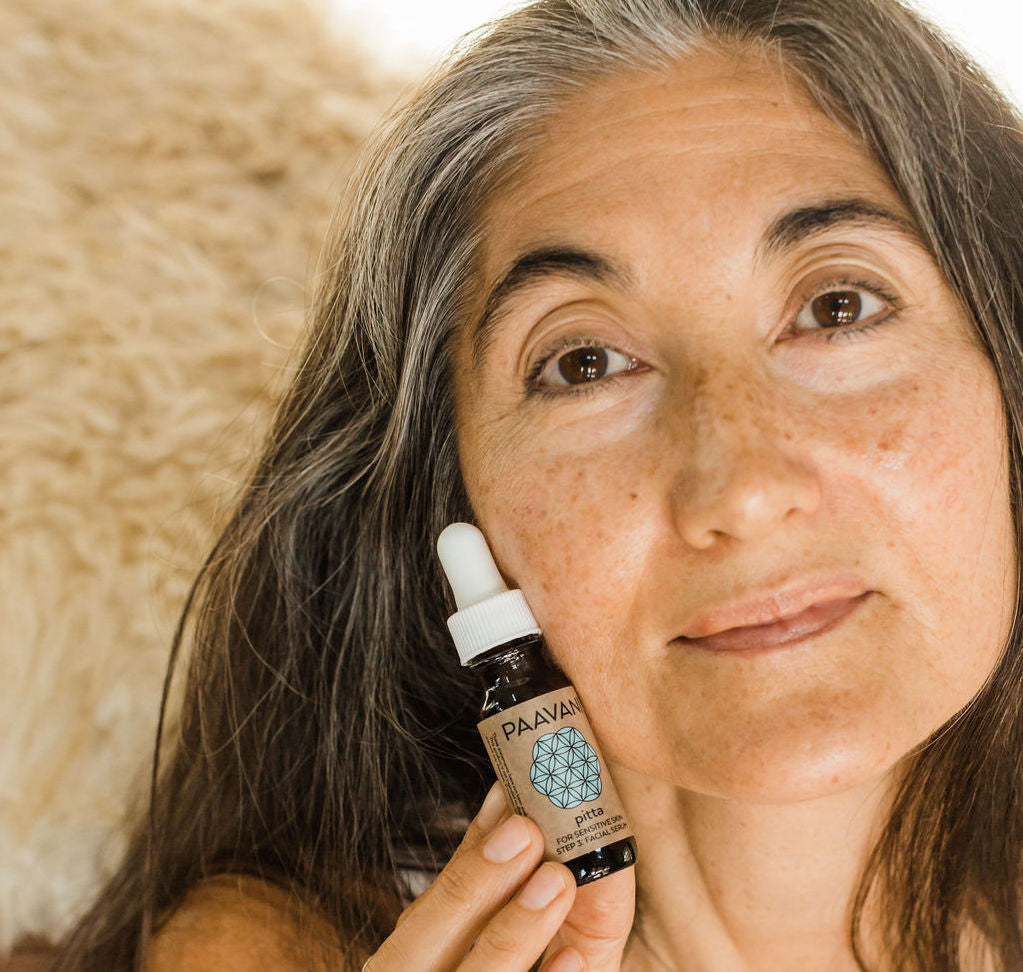 woman holding PAAVANI Facial Serum